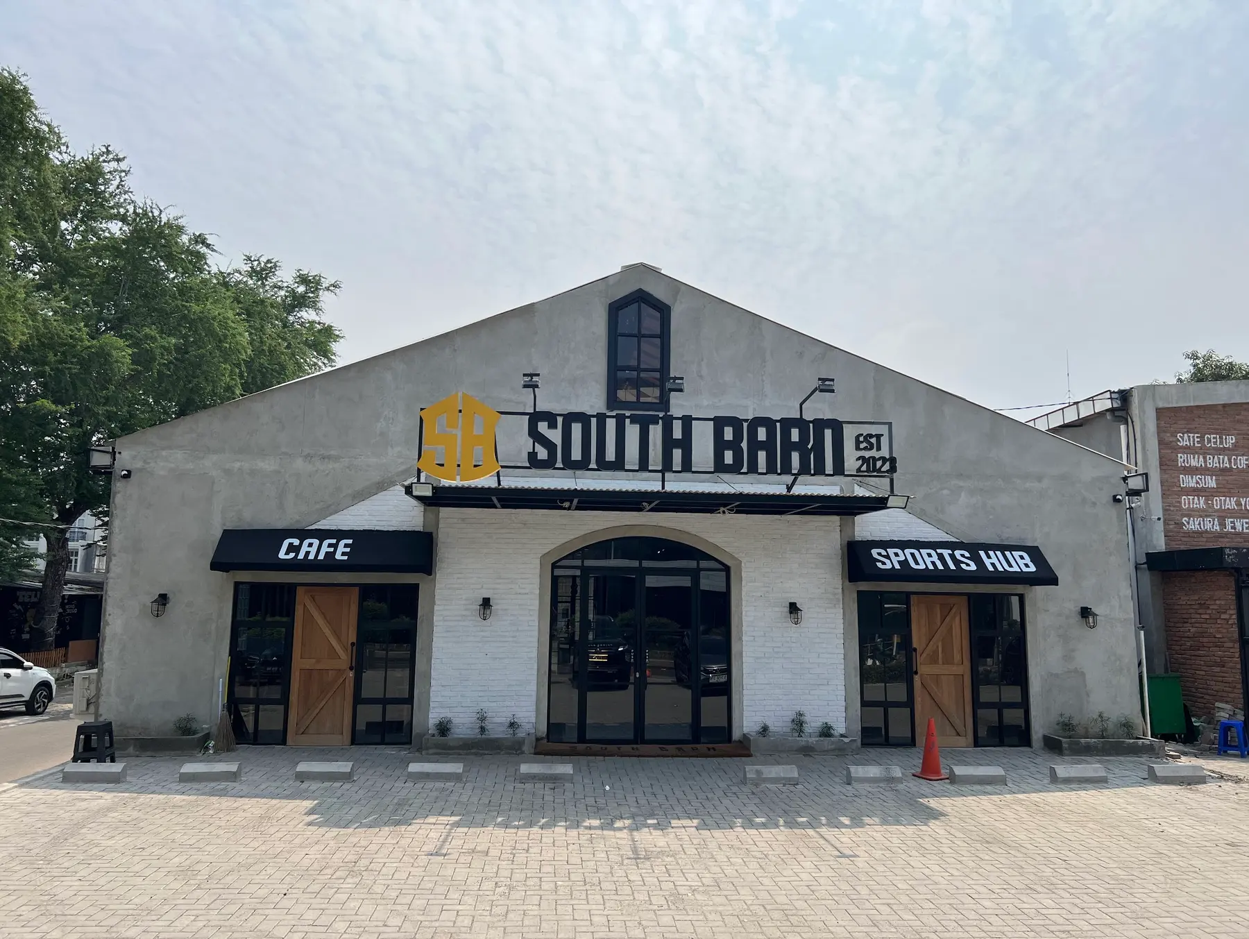 The white barn-style South Barn building on Jl. Kemang Raya
